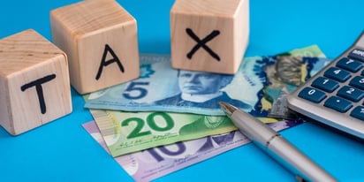 Canadian tax money with calculator