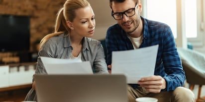 couple working through a budget to pay off debt