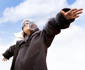 Young kid dreaming of being a pilot looking at the sky
