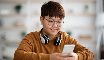 kid learning about money on phone