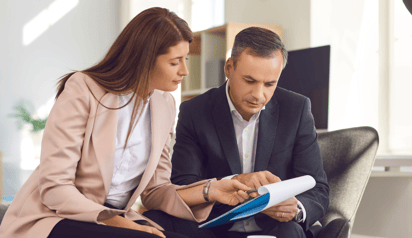 man and women discussing a debt consolidation program