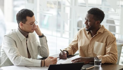 two mean talking about debt management strategies