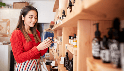 woman wearing a red sweater shopping