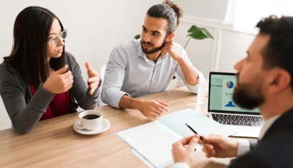 a man and a women talking to a mortgage specialist about private mortgages