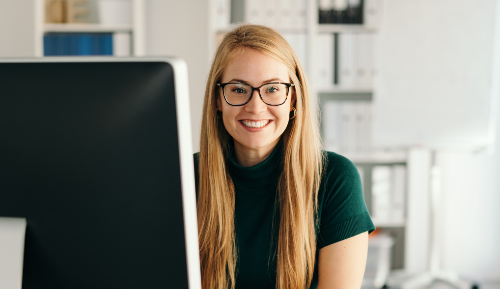 woman wearing glasses smiling