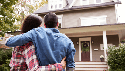 couple looking at their house