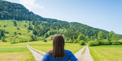 woman choosing between two different paths debt consolidation vs bankruptcy concept.